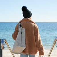 Woman carrying Cooler bags at the beach