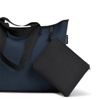 Neoprene bag in navy with double straps and attachements